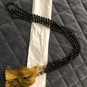 Mala necklace black faceted crystal ( set of two ) silk tassel with Buddha head.